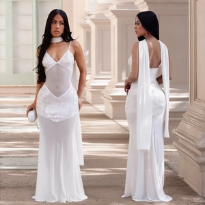 Detailed view of the white sequin mesh gown with a floor-length cape and choker necklace
