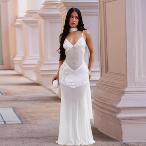 Detail of white sequins and sheer mesh fabric on a sexy V-neck bodycon evening dress