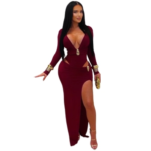 Detail of burgundy V-neck dress with waist cut-outs and golden metal decorative buckles