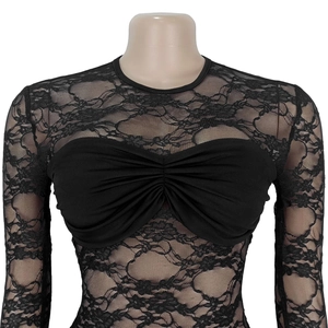 Close-up of black sheer lace long sleeve top with pleated bust detail on a mannequin
