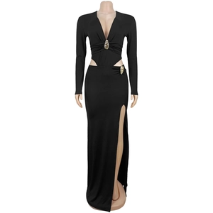 Detail of elegant black deep V-neck dress with gold decorative buttons and side slit