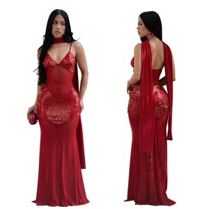 Detail of red mesh evening dress with sequins, V-neck, and elegant back ribbons