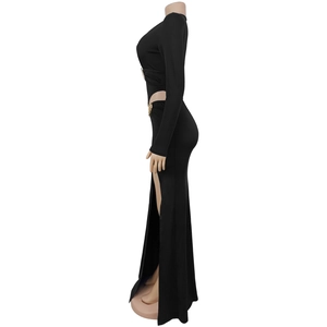 Detail view of black evening dress with side waist cutout and golden metal ring accent