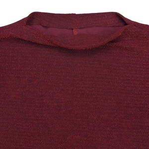 Detail of burgundy evening dress featuring glittery knit fabric and a chic round neckline