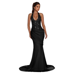 Elegant black sequin halter evening gown featuring cross-waist draping and mermaid tail