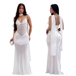 Detail of white sequin mermaid evening dress with mesh panels and long shoulder capes