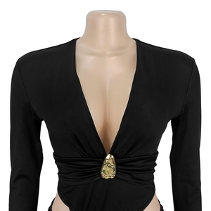 Detail of deep V-neck black bodysuit with gold metal buckle and pleated design