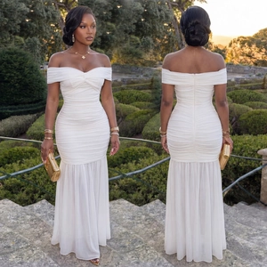 Detail of white ruched off-shoulder evening dress with fishtail hem and mesh tail