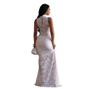 Detailed back view of white lace maxi dress with keyhole opening and floral patterns