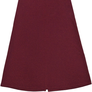 Close-up of elegant wine red dress hem featuring subtle metallic shimmer fabric and slit