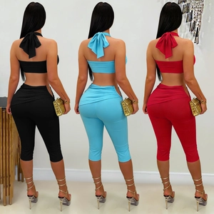 Women's two-piece fashion set with halter backless bow top and slim fit cropped pants