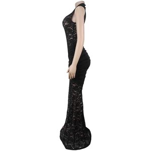 Detail of black lace panels and pleated fabric on a slim fit maxi dress with a slit