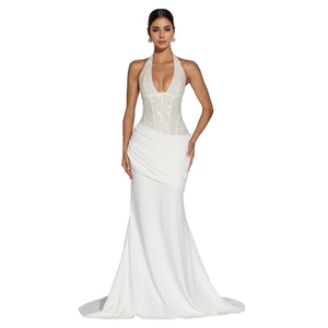 Detail of elegant halter neck dress featuring sequined bodice and mermaid skirt silhouette