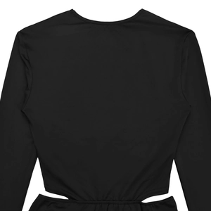Detail view of the sleek waist cut-outs and stitching on this black long sleeve dress