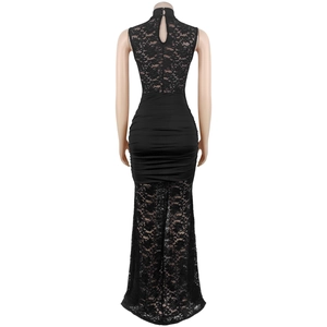 Detailed back view of a black evening gown with lace inserts and ruching details