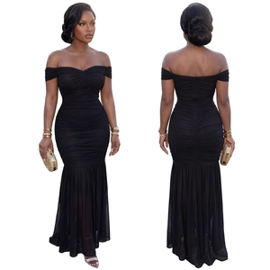 Detail of off-the-shoulder black mermaid dress featuring elegant ruching and slim fit style