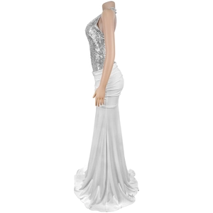 Detail of silver sequin halter top and elegant white mermaid evening gown silhouette