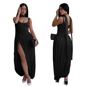 Detail view of black bodycon maxi dress with side slit and neck scarf accent