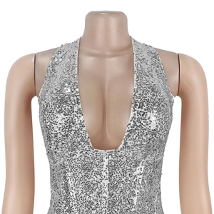 Close-up of elegant halter dress with dense silver sequins and deep V-neckline