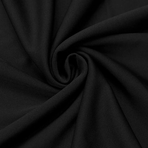 Close-up of the black knitted fabric texture on a sexy V-neck bodycon long sleeve dress