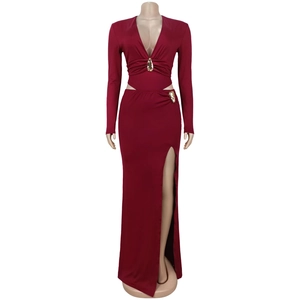 Detail of burgundy V-neck dress featuring hollow-out waist and gold metal hardware