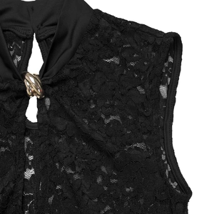 Macro detail of black lace dress with gold interlocking ring buckle and cutout design