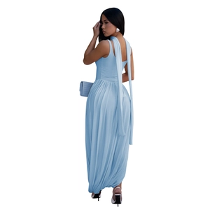 Detail view of light blue sleeveless dress featuring long back ribbons and elegant draping