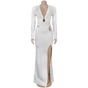 Detail of white deep V-neck dress with golden metallic charms and waist cut-out feature