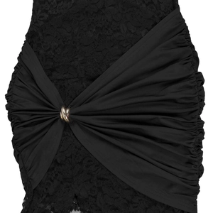 Detail of floral lace dress with a golden metal ring and pleated fabric texture