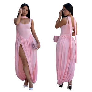 Detail of pink sleeveless halter dress with elegant waist pleats and high slit hemline