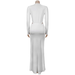 Detailed back view of white long sleeve maxi dress featuring elegant cutout back design