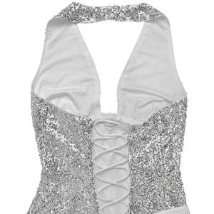 Detail of white sequined halter neck dress with criss-cross lace-up back design