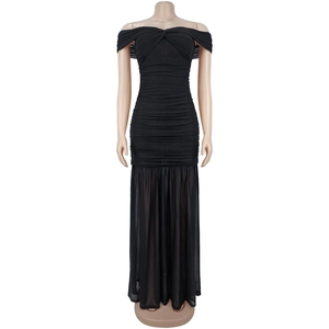 Detail of ruched black off-shoulder dress featuring sheer mesh mermaid hemline