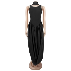 Detail of black sleeveless maxi dress with matching neck scarf and draped pleated skirt