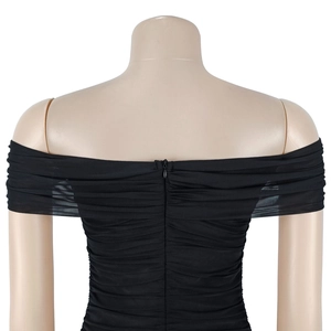 Detail view of the ruched back design and hidden zipper on this black mesh off-shoulder dress