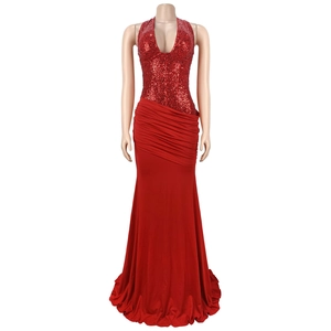 Detail of red sequined halter neck dress with deep V-neck and asymmetric pleated waistline