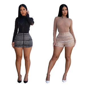 Chic long sleeve turtleneck bodysuit with rhinestone embellished shorts in black and beige