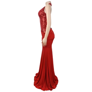 Detail of red sequined halter neckline and elegant open back on mermaid evening gown