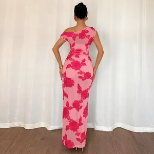 Close-up of pink mesh dress with elegant diagonal shoulder and 3D floral embroidery details