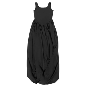 Detail of elegant black sleeveless maxi dress featuring pleated skirt and draped silhouette