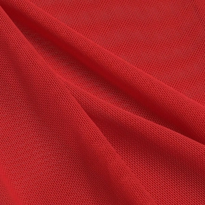 Close-up of vibrant red mesh fabric showing detailed texture and soft draping