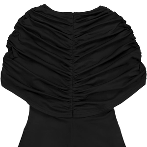 Detail view of the elegant ruched back design and invisible zipper on black jumpsuit