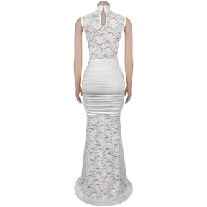 Detail view of the white floral lace stitching and ruched back design of this slim dress