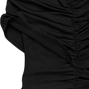 Detail of elegant black jumpsuit showing ruched fabric and high-quality double stitching