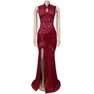 Detail of dark red lace evening dress featuring a high side slit and hollow-out neckline