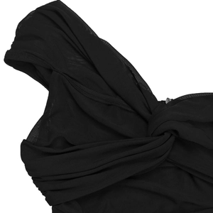 Close-up of black mesh fabric detail with elegant ruched textures and a hidden zipper