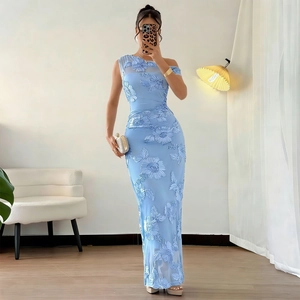 Detail of light blue one-shoulder dress with 3D floral embroidery and mesh paneling