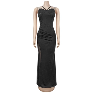 Detail of elegant black dress with shimmering rhinestones and sheer mesh patchwork