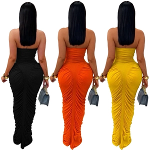 Close-up of ruched detail and elastic fabric on bodycon strapless maxi dresses