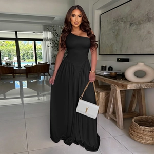 Elegant black one-shoulder maxi dress with ruched waist and flowing asymmetric silhouette